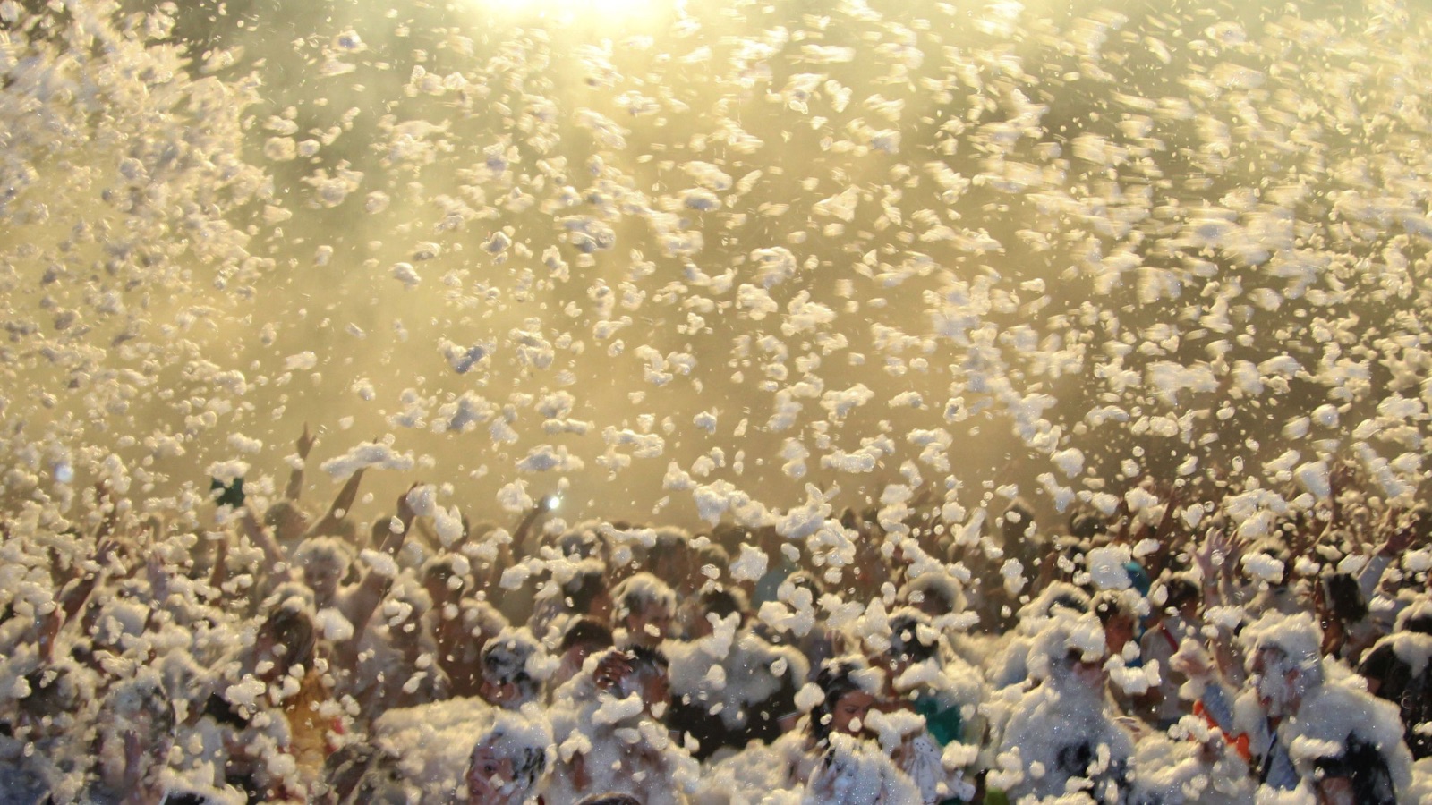 Three friends covered in foam